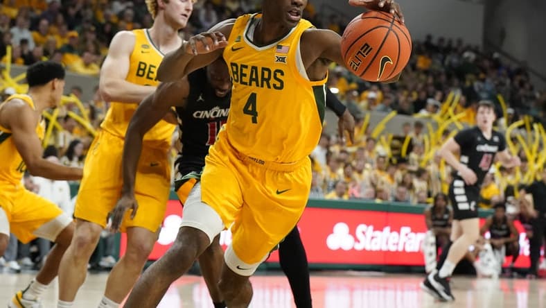 Jan 13, 2024; Waco, Texas, USA; Baylor Bears guard Ja'Kobe Walter (4) grabs the rebound against the Cincinnati Bearcats during the first half at Paul and Alejandra Foster Pavilion. Mandatory Credit: Raymond Carlin III-USA TODAY Sports