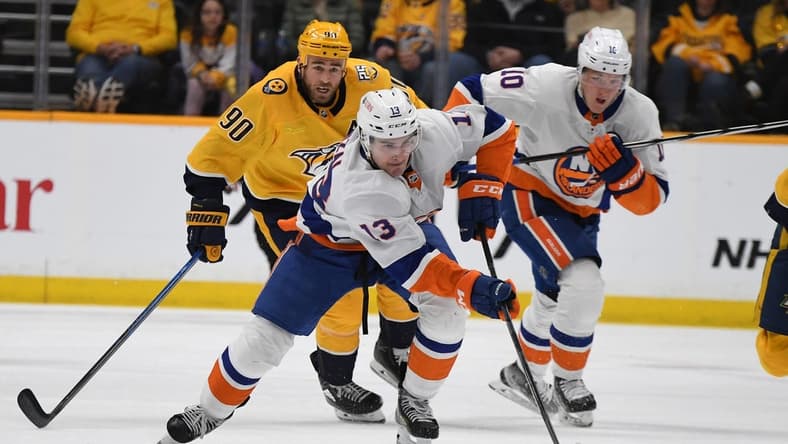Jan 13, 2024; Nashville, Tennessee, USA; New York Islanders center Mathew Barzal (13) skates with the puck during the second period against the Nashville Predators at Bridgestone Arena. Mandatory Credit: Christopher Hanewinckel-USA TODAY Sports