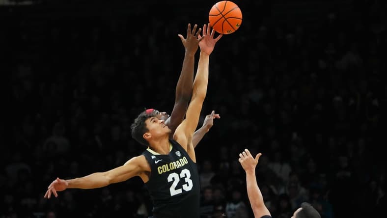 Jan 13, 2024; Boulder, Colorado, USA; USC Trojans forward Vincent Iwuchukwu (3) and Colorado Buffaloes forward Tristan da Silva (23) reach for the tip off in the first half at the CU Events Center. Mandatory Credit: Ron Chenoy-USA TODAY Sports