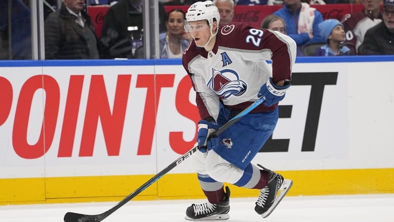 Jan 13, 2024; Toronto, Ontario, CAN; Colorado Avalanche forward Nathan MacKinnon (29) carries the puck against the Toronto Maple Leafs during the second period at Scotiabank Arena. Mandatory Credit: John E. Sokolowski-USA TODAY Sports