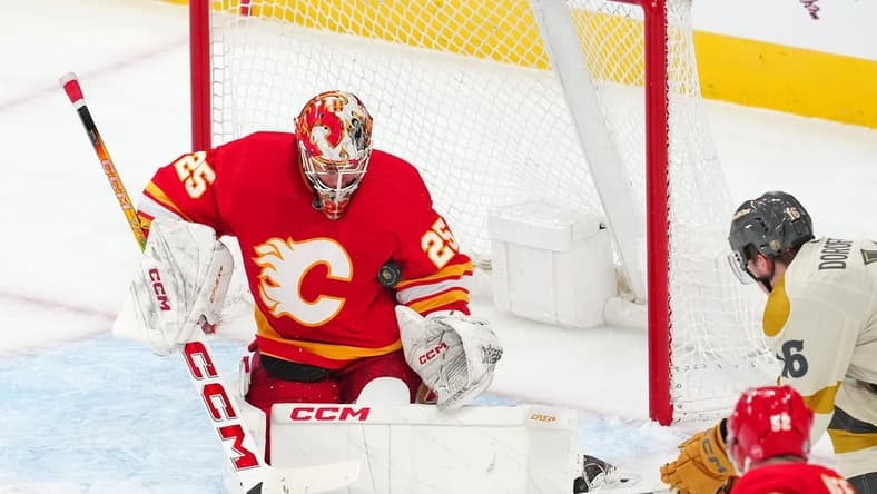Jan 13, 2024; Las Vegas, Nevada, USA; Calgary Flames goaltender Jacob Markstrom (25) makes a save against the Vegas Golden Knights during the third period at T-Mobile Arena. Mandatory Credit: Stephen R. Sylvanie-USA TODAY Sports
