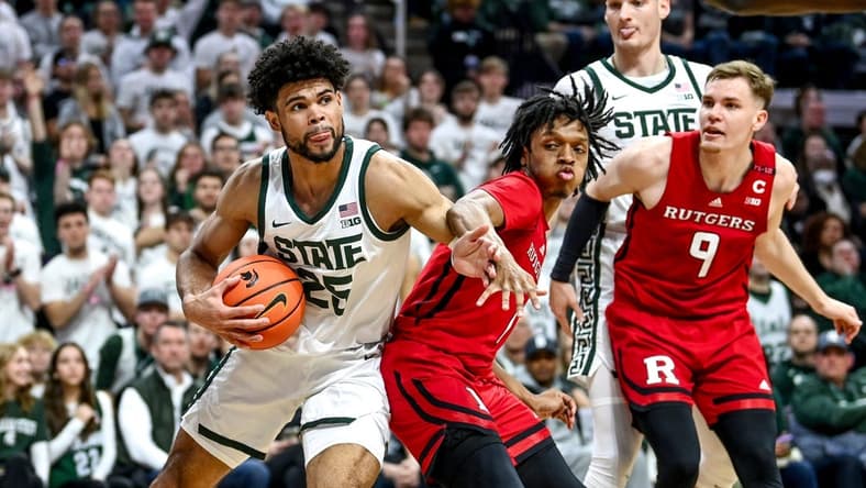 Michigan State's Malik Hall, left, looks for room as Rutgers' Jamichael Davis defends during the first half on Sunday, Jan. 14, 2024, at the Breslin Center in East Lansing.