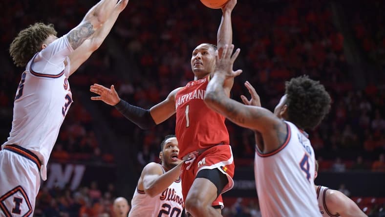 Jan 14, 2024; Champaign, Illinois, USA; Maryland Terrapins guard Jahmir Young (1) shoots the ball over Illinois Fighting Illini forward Coleman Hawkins (33) on a drive to the basket during the second half at State Farm Center. Mandatory Credit: Ron Johnson-USA TODAY Sports