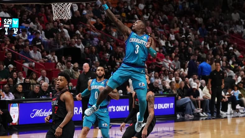 Jan 14, 2024; Miami, Florida, USA; Charlotte Hornets guard Terry Rozier (3) puts up a shot against the Miami Heat during the second half at Kaseya Center. Mandatory Credit: Jasen Vinlove-USA TODAY Sports