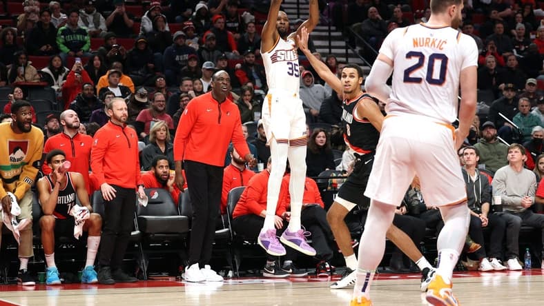 Jan 14, 2024; Portland, Oregon, USA; Phoenix Suns forward Kevin Durant (35) shoots a three-point shot over Portland Trail Blazers forward Kris Murray (8) as Phoenix Suns center Jusuf Nurkic (20) looks on in the fourth quarter at Moda Center. Mandatory Credit: Jaime Valdez-USA TODAY Sports