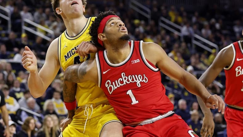 Jan 15, 2024; Ann Arbor, Michigan, USA; Michigan Wolverines forward Will Tschetter (42) and Ohio State Buckeyes guard Roddy Gayle Jr. (1) look for the rebound in the first half at Crisler Center. Mandatory Credit: Rick Osentoski-USA TODAY Sports