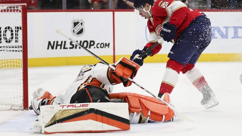 Jan 15, 2024; Sunrise, Florida, USA; Florida Panthers center Evan Rodrigues (17) shoots as Anaheim Ducks goaltender John Gibson (36) makes a save during the second period at Amerant Bank Arena. Mandatory Credit: Sam Navarro-USA TODAY Sports