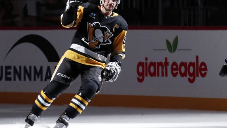 Jan 15, 2024; Pittsburgh, Pennsylvania, USA;  Pittsburgh Penguins center Sidney Crosby (87) reacts after being named a star of the game against the Seattle Kraken at PPG Paints Arena. Mandatory Credit: Charles LeClaire-USA TODAY Sports