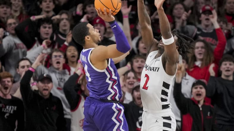 Jan 16, 2024; Cincinnati, Ohio, USA;  TCU Horned Frogs guard Jameer Nelson Jr. (4) drives to the basket against Cincinnati Bearcats guard Jizzle James (2) in the first half at Fifth Third Arena. Mandatory Credit: Aaron Doster-USA TODAY Sports