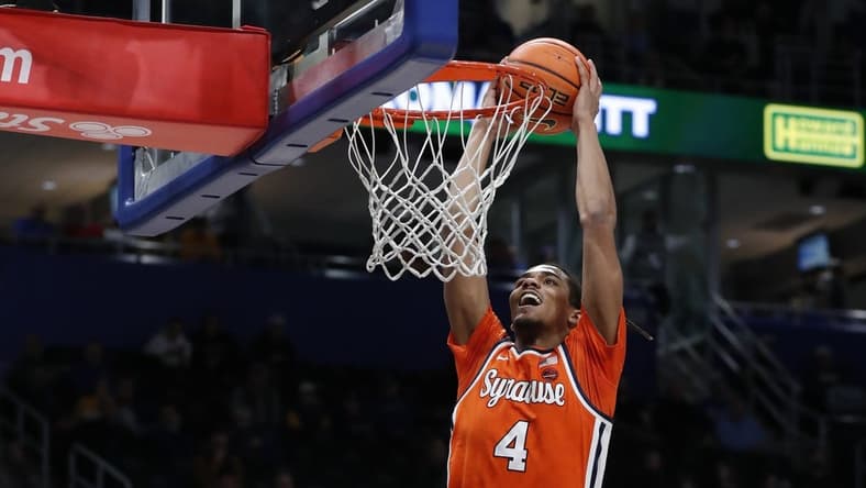 Jan 16, 2024; Pittsburgh, Pennsylvania, USA; Syracuse Orange forward Chris Bell (4) dunks the ball on a breakaway against the Pittsburgh Panthers during the first half at the Petersen Events Center. Mandatory Credit: Charles LeClaire-USA TODAY Sports