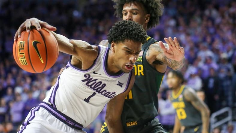 Jan 16, 2024; Manhattan, Kansas, USA; Kansas State Wildcats forward David N'Guessan (1) is guarded by Baylor Bears forward Jalen Bridges (11) during the first half at Bramlage Coliseum. Mandatory Credit: Scott Sewell-USA TODAY Sports