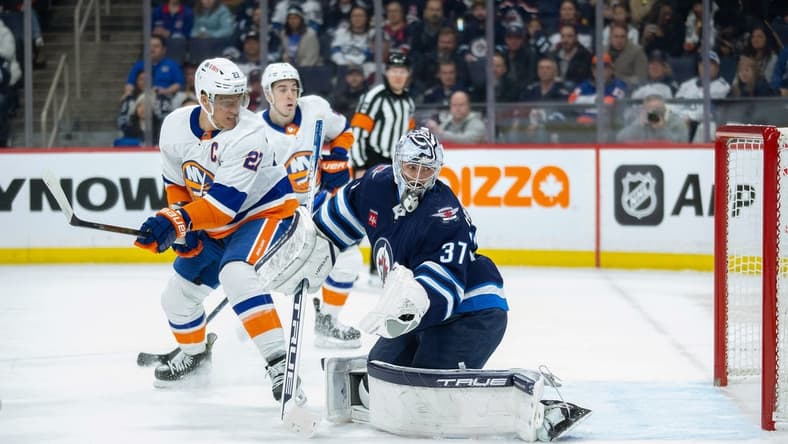 Jan 16, 2024; Winnipeg, Manitoba, CAN; New York Islanders forward Anders Lee (27) (not shown) scores on Winnipeg Jets goalie Connor Hellebuyck (37) during the first period at Canada Life Centre. Mandatory Credit: Terrence Lee-USA TODAY Sports