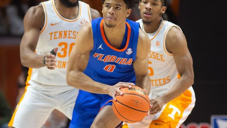Florida's Zyon Pullin (0) is pressed guarded by Tennessee's Josiah-Jordan James (30) and Zakai Zeigler (5) during an NCAA basketball game on Tuesday, January 16, 2024 in Knoxville, Tenn.