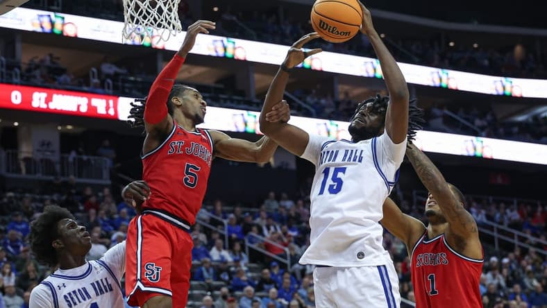 Jan 16, 2024; Newark, New Jersey, USA; Seton Hall Pirates center Jaden Bediako (15) rebounds against St. John's Red Storm center Joel Soriano (11) and guard Daniss Jenkins (5) in front of guard Kadary Richmond (1) during the first half at Prudential Center. Mandatory Credit: Vincent Carchietta-USA TODAY Sports