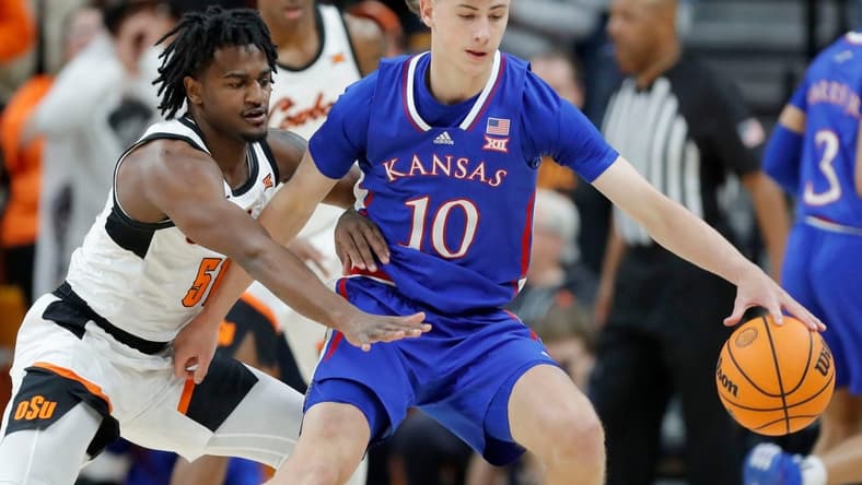 Oklahoma State Cowboys guard John-Michael Wright (51) defends Kansas Jayhawks guard Johnny Furphy (10) during a college basketball game between the Oklahoma State University Cowboys (OSU) and the Kansas Jayhawks at Gallagher-Iba Arena in Stillwater, Okla., Tuesday, Jan. 16, 2024.