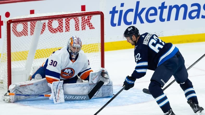 Jan 16, 2024; Winnipeg, Manitoba, CAN; New York Islanders goalie Ilya Sorokin (30) prepares for a shot by Winnipeg Jets forward Nino Niederreiter (62) during the third period at Canada Life Centre. Mandatory Credit: Terrence Lee-USA TODAY Sports
