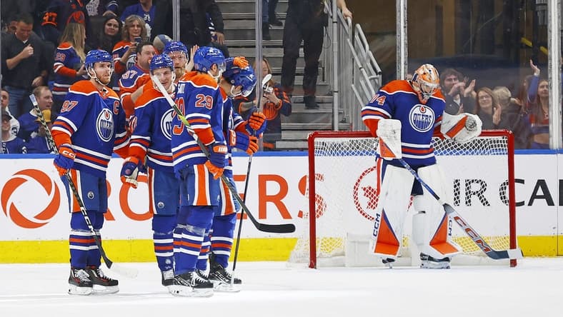 Jan 16, 2024; Edmonton, Alberta, CAN; The Edmonton Oilers celebrate a goal scored by defensemen Evan Bouchard (2) during the third period against the Toronto Maple Leafs at Rogers Place. Mandatory Credit: Perry Nelson-USA TODAY Sports