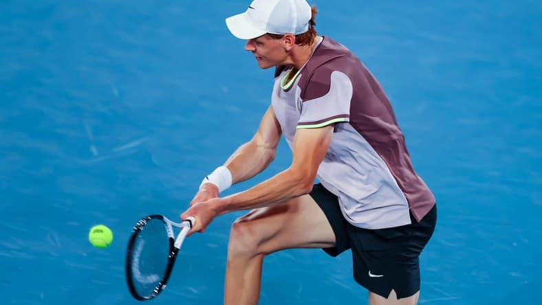 Jan 17, 2024; Melbourne, Victoria, Australia; Jannik Sinner of Italy plays a shot against Jesper de Jong (not pictured) of Netherlands in Round 2 of the Men's Singles on Day 4 of the Australian Open tennis at Rod Laver Arena.Mandatory Credit: Mike Frey-USA TODAY Sports