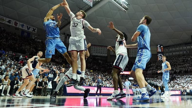 Jan 17, 2024; Storrs, Connecticut, USA; Connecticut Huskies center Donovan Clingan (32) blocks the shot of Creighton Bluejays guard Trey Alexander (23) in the first half at Harry A. Gampel Pavilion. Mandatory Credit: David Butler II-USA TODAY Sports