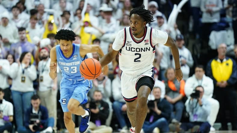Jan 17, 2024; Storrs, Connecticut, USA; Connecticut Huskies guard Tristen Newton (2) returns the ball against Creighton Bluejays guard Trey Alexander (23) in the second half at Harry A. Gampel Pavilion. Mandatory Credit: David Butler II-USA TODAY Sports