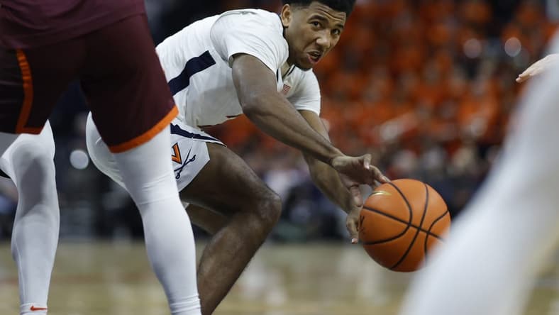 Jan 17, 2024; Charlottesville, Virginia, USA; Virginia Cavaliers guard Reece Beekman (2) passes the ball against the Virginia Tech Hokies in the second half at John Paul Jones Arena. Mandatory Credit: Geoff Burke-USA TODAY Sports