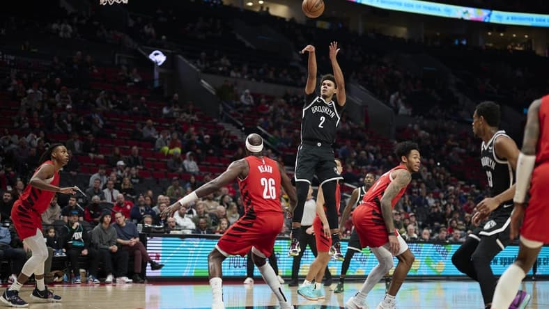 Jan 17, 2024; Portland, Oregon, USA; Brooklyn Nets forward Cameron Johnson (2) shoots a basket during the first half against Portland Trail Blazers center Duop Reath (26) at Moda Center. Mandatory Credit: Troy Wayrynen-USA TODAY Sports