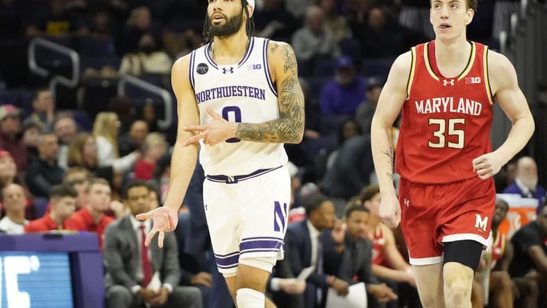 Jan 17, 2024; Evanston, Illinois, USA; Northwestern Wildcats guard Boo Buie (0) gestures after a three point basket against the Maryland Terrapins during the first half at Welsh-Ryan Arena. Mandatory Credit: David Banks-USA TODAY Sports