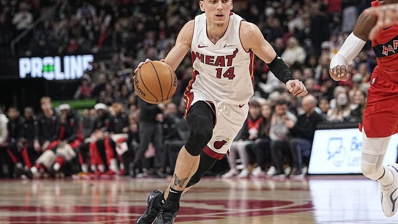 Jan 17, 2024; Toronto, Ontario, CAN; Miami Heat guard Tyler Herro (14) dribbles to the net against the Toronto Raptors during the first half at Scotiabank Arena. Mandatory Credit: John E. Sokolowski-USA TODAY Sports