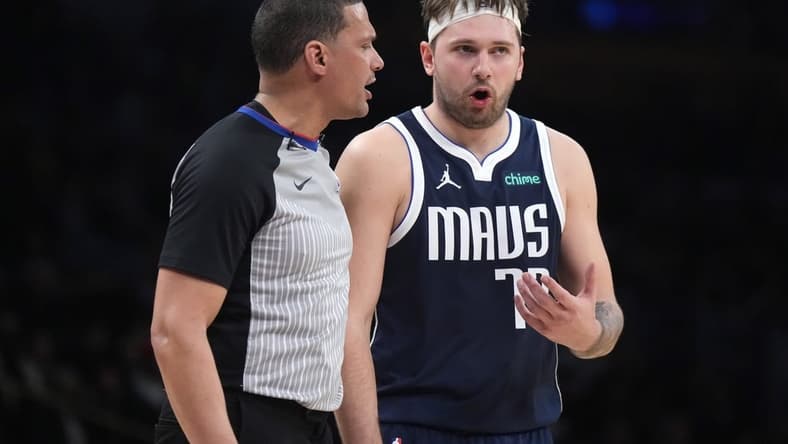 Jan 17, 2024; Los Angeles, California, USA; Dallas Mavericks guard Luka Doncic (77) reacts to a call by referee Nate Green in the second half against the Los Angeles Lakers at Crypto.com Arena. Mandatory Credit: Kirby Lee-USA TODAY Sports