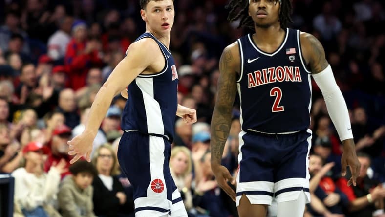 Jan 17, 2024; Tucson, Arizona, USA; Arizona Wildcats guard Pelle Larsson (3) runs down the court with guard Caleb Love (2) against the USC Trojans during the second half at McKale Center. Mandatory Credit: Zachary BonDurant-USA TODAY Sports