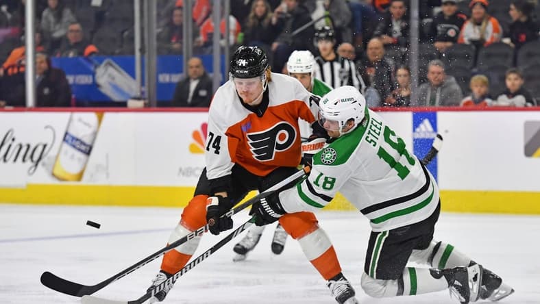 Jan 18, 2024; Philadelphia, Pennsylvania, USA; Philadelphia Flyers right wing Owen Tippett (74) and Dallas Stars center Sam Steel (18) battle for the puck during the first period at Wells Fargo Center. Mandatory Credit: Eric Hartline-USA TODAY Sports