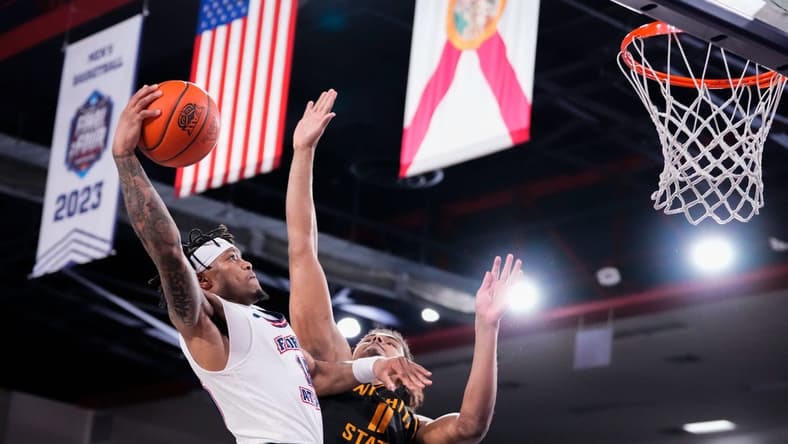 Jan 18, 2024; Boca Raton, Florida, USA; Florida Atlantic Owls guard Alijah Martin (15) goes up for a shot against Wichita State Shockers forward Kenny Pohto (11) during the second half at Eleanor R. Baldwin Arena. Mandatory Credit: Rich Storry-USA TODAY Sports