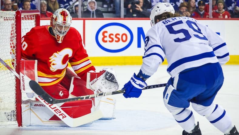 Jan 18, 2024; Calgary, Alberta, CAN; Calgary Flames goaltender Dan Vladar (80) guards his net against Toronto Maple Leafs left wing Tyler Bertuzzi (59) during the first period at Scotiabank Saddledome. Mandatory Credit: Sergei Belski-USA TODAY Sports