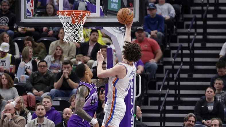 Jan 18, 2024; Salt Lake City, Utah, USA; Oklahoma City Thunder guard Josh Giddey (3) is fouled by Utah Jazz forward John Collins (20) while shooting the ball during the second half at Delta Center. Mandatory Credit: Chris Nicoll-USA TODAY Sports