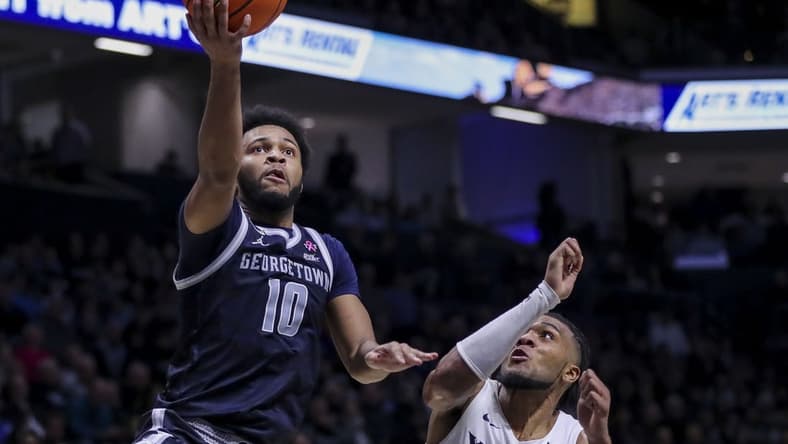 Jan 19, 2024; Cincinnati, Ohio, USA; Georgetown Hoyas guard Jayden Epps (10) shoots against Xavier Musketeers guard Dayvion McKnight (20) in the second half at Cintas Center. Mandatory Credit: Katie Stratman-USA TODAY Sports