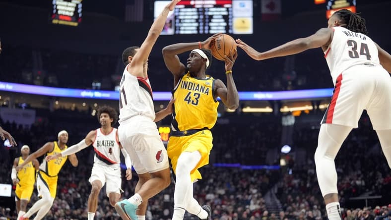 Jan 19, 2024; Portland, Oregon, USA; Indiana Pacers power forward Pascal Siakam (43) looks to pass while defended by Portland Trail Blazers point guard Malcolm Brogdon (11) during the first half at Moda Center. Mandatory Credit: Soobum Im-USA TODAY Sports