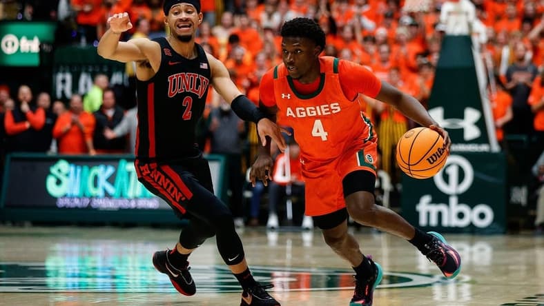 Jan 19, 2024; Fort Collins, Colorado, USA; Colorado State Rams guard Isaiah Stevens (4) controls the ball as UNLV Rebels guard Justin Webster (2) guards in the second half at Moby Arena. Mandatory Credit: Isaiah J. Downing-USA TODAY Sports