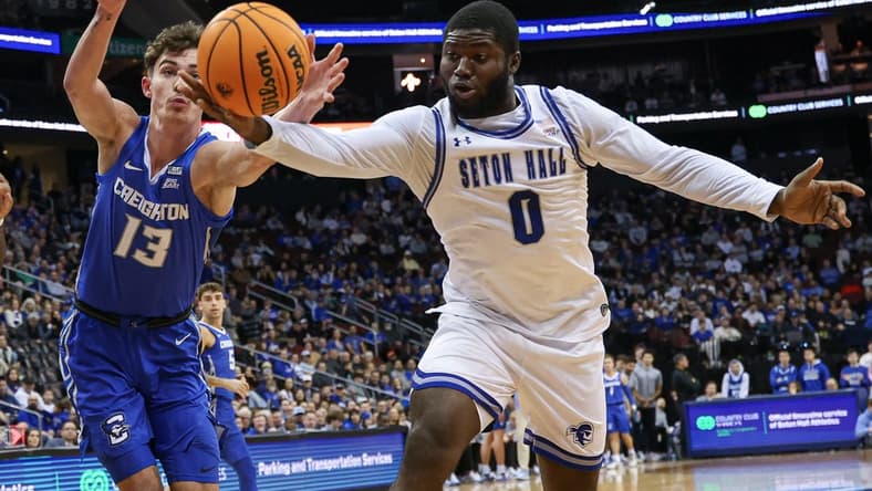 Jan 20, 2024; Newark, New Jersey, USA; Seton Hall Pirates guard Dylan Addae-Wusu (0) reaches for the ball against Creighton Bluejays forward Mason Miller (13) during the first half at Prudential Center. Mandatory Credit: Vincent Carchietta-USA TODAY Sports