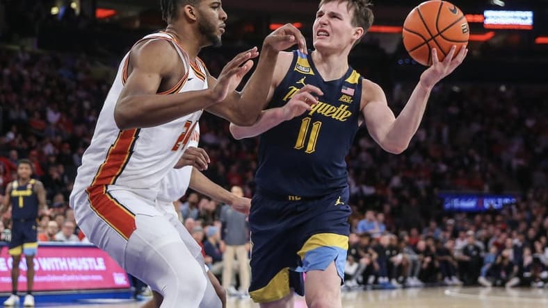Jan 20, 2024; New York, New York, USA;  Marquette Golden Eagles guard Tyler Kolek (11) looks to drive past St. John's Red Storm forward Zuby Ejiofor (24) in the first half at Madison Square Garden. Mandatory Credit: Wendell Cruz-USA TODAY Sports