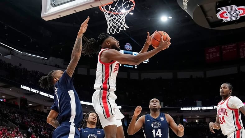 Jan 20, 2024; Columbus, Ohio, USA; Ohio State Buckeyes guard Evan Mahaffey (12) shoots around Penn State Nittany Lions guard Nick Kern Jr. (3) during the NCAA men   s basketball game at Value City Arena.