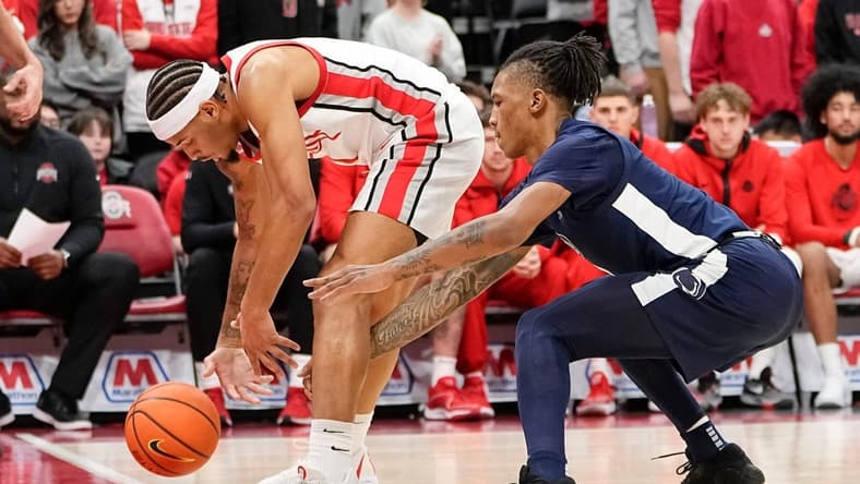 Jan 20, 2024; Columbus, Ohio, USA; Penn State Nittany Lions guard Nick Kern Jr. (3) pokes the ball out of bounds between the legs of Ohio State Buckeyes guard Roddy Gayle Jr. (1) during the second half of the NCAA men s basketball game at Value City Arena. Ohio State won 79-67.