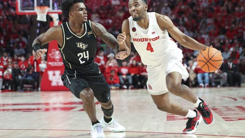 Jan 20, 2024; Houston, Texas, USA; Houston Cougars guard L.J. Cryer (4) drives with the ball as UCF Knights guard Jaylin Sellers (24) defends during the first half at Fertitta Center. Mandatory Credit: Troy Taormina-USA TODAY Sports