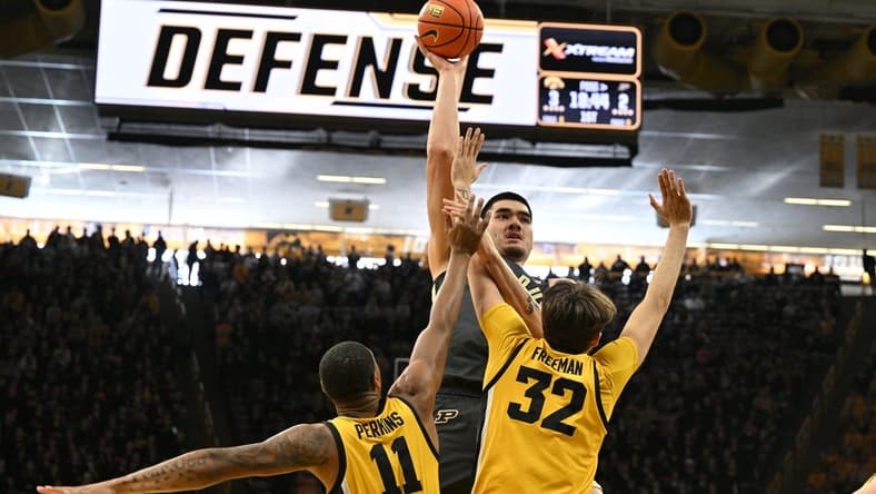 Jan 20, 2024; Iowa City, Iowa, USA; Purdue Boilermakers center Zach Edey (15) shoots the ball over Iowa Hawkeyes forward Owen Freeman (32) and guard Tony Perkins (11) during the first half at Carver-Hawkeye Arena. Mandatory Credit: Jeffrey Becker-USA TODAY Sports