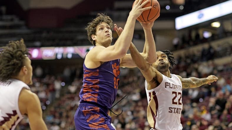 Jan 20, 2024; Tallahassee, Florida, USA; Florida State Seminoles guard Darin Green Jr (22) pressures Clemson Tigers center PJ Hall (24) during the first half at Donald L. Tucker Center. Mandatory Credit: Melina Myers-USA TODAY Sports