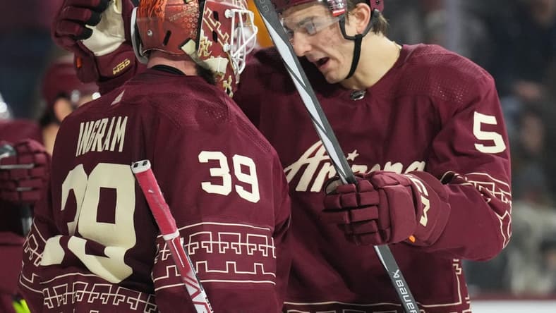 Jan 20, 2024; Tempe, Arizona, USA; Arizona Coyotes goaltender Connor Ingram (39) and Arizona Coyotes defenseman Michael Kesselring (5) celebrate after defeating the Nashville Predators during at Mullett Arena. Mandatory Credit: Joe Camporeale-USA TODAY Sports