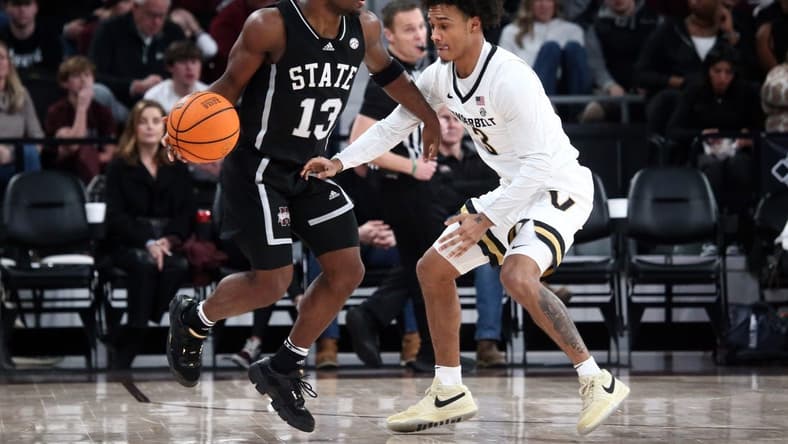 Jan 20, 2024; Starkville, Mississippi, USA; Mississippi State Bulldogs guard Josh Hubbard (13) dribbles as Vanderbilt Commodores guard Paul Lewis (3) defends during the second half at Humphrey Coliseum. Mandatory Credit: Petre Thomas-USA TODAY Sports