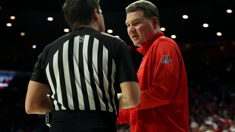 Jan 20, 2024; Tucson, Arizona, USA; Arizona Wildcats head coach Tommy Lloyd talks to the referee during a timeout against the UCLA Bruins during the second half at McKale Center. Mandatory Credit: Zachary BonDurant-USA TODAY Sports