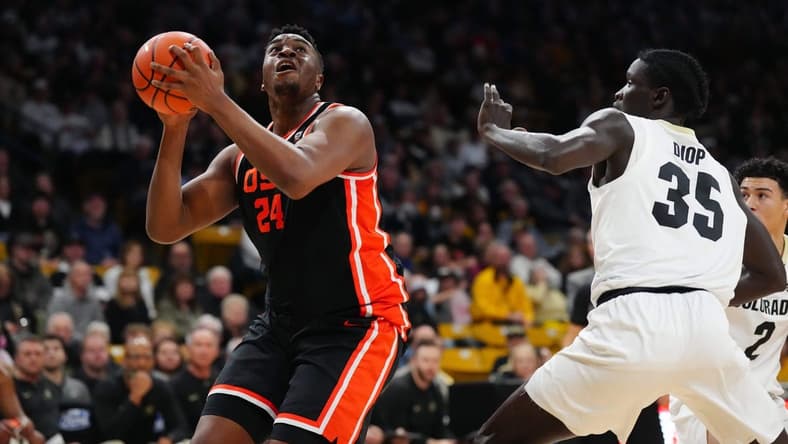 Jan 20, 2024; Boulder, Colorado, USA; Oregon State Beavers center KC Ibekwe (24) and Colorado Buffaloes forward Assane Diop (35) during the first half at the CU Events Center. Mandatory Credit: Ron Chenoy-USA TODAY Sports