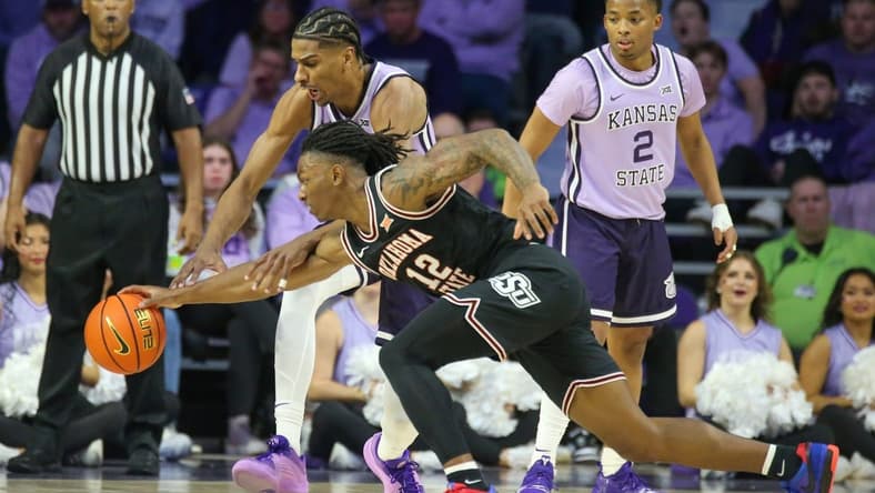 Jan 20, 2024; Manhattan, Kansas, USA; Oklahoma State Cowboys guard Javon Small (12) and Kansas State Wildcats forward David N'Guessan (1) go after a loose ball during the first half at Bramlage Coliseum. Mandatory Credit: Scott Sewell-USA TODAY Sports