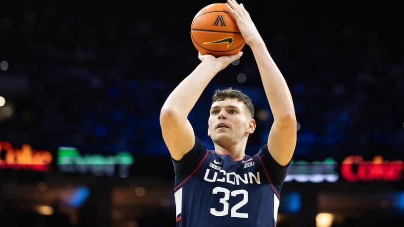 Jan 20, 2024; Philadelphia, Pennsylvania, USA; Connecticut Huskies center Donovan Clingan (32) shoots the ball against the Villanova Wildcats during the first half at Wells Fargo Center. Mandatory Credit: Bill Streicher-USA TODAY Sports